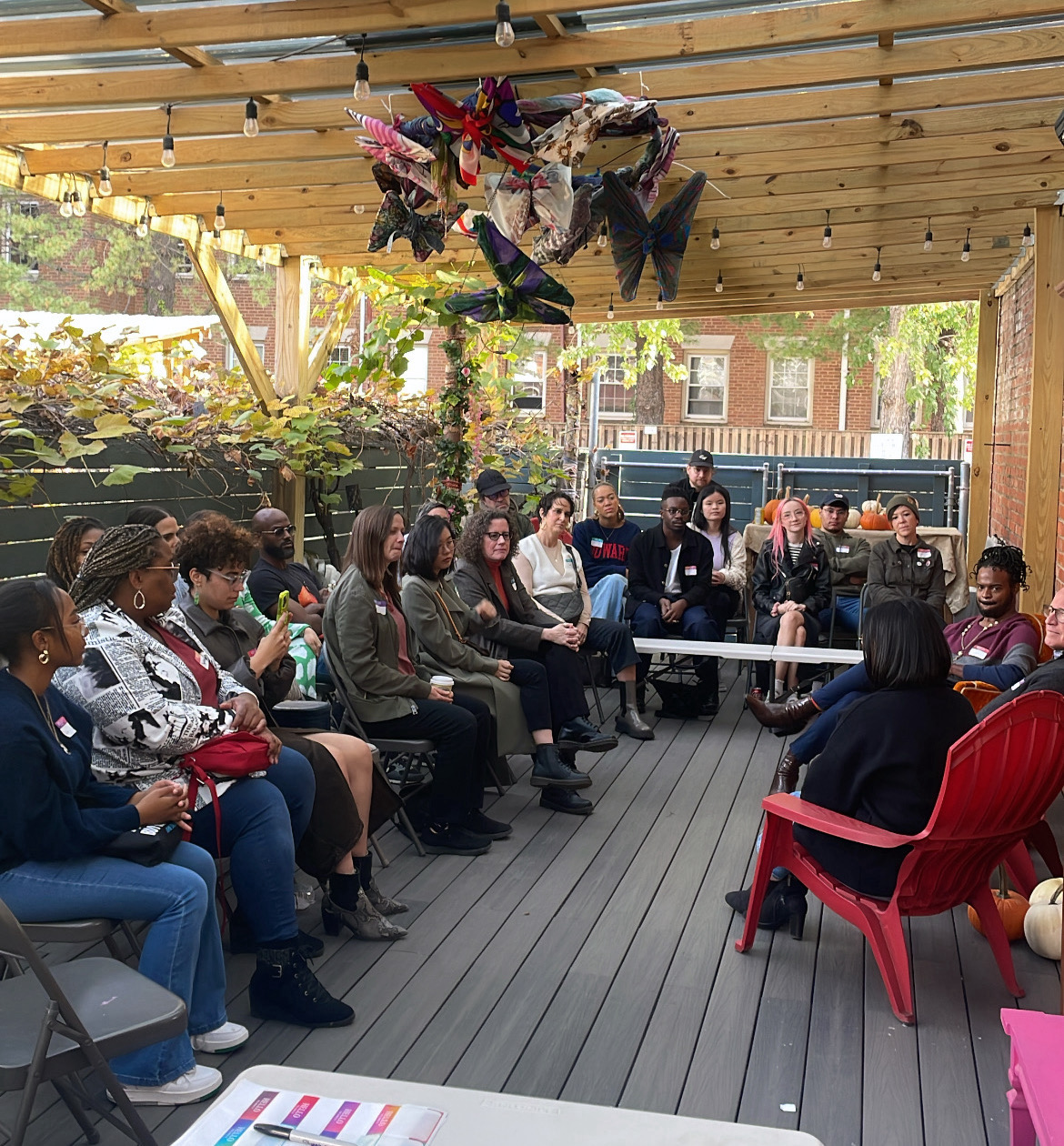 A group photo of a panel discussion event callled, AI x Design