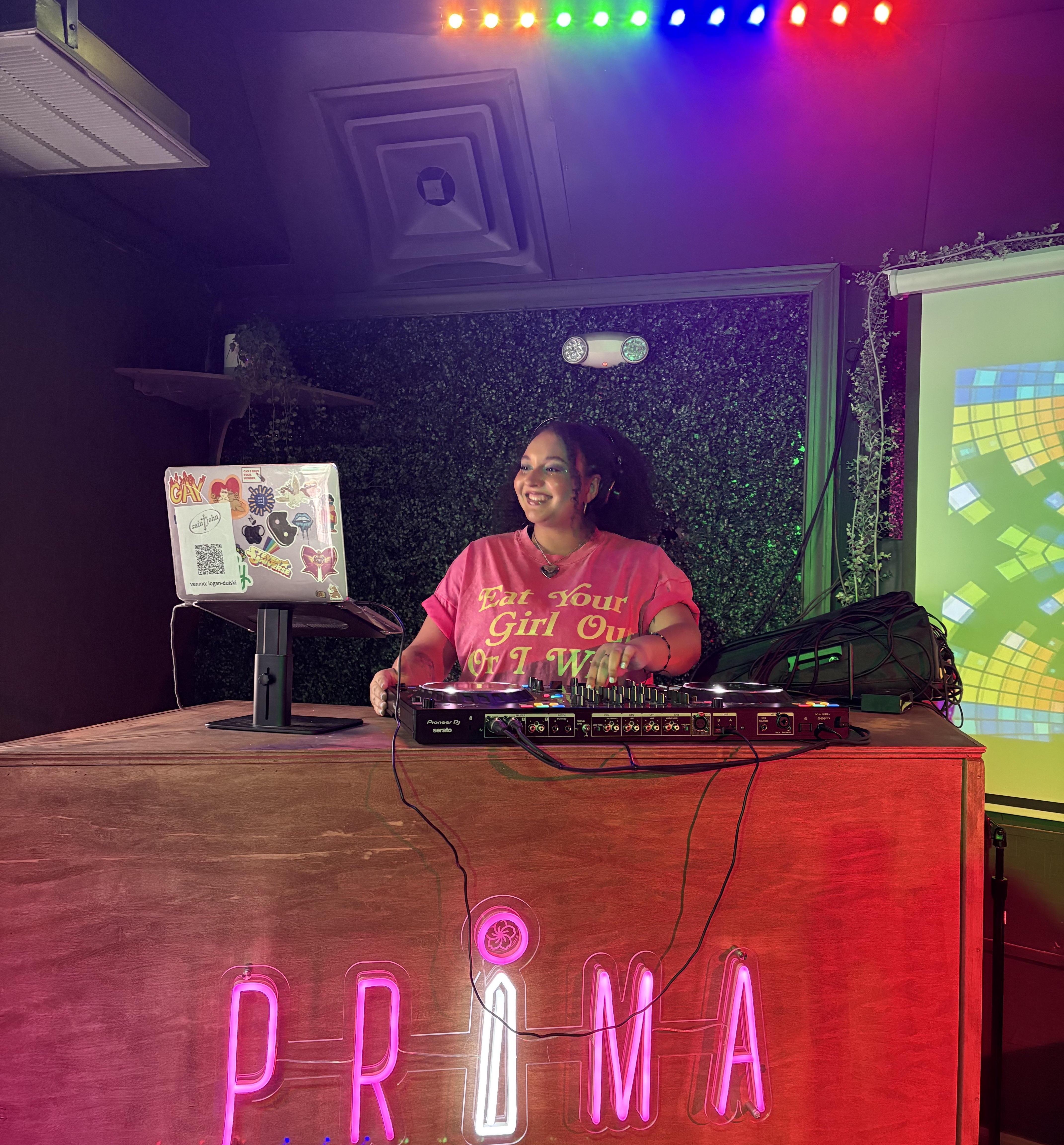 A photo of DJ SAINTJOHN at a live event behind the booth a PRIDE 2025 event