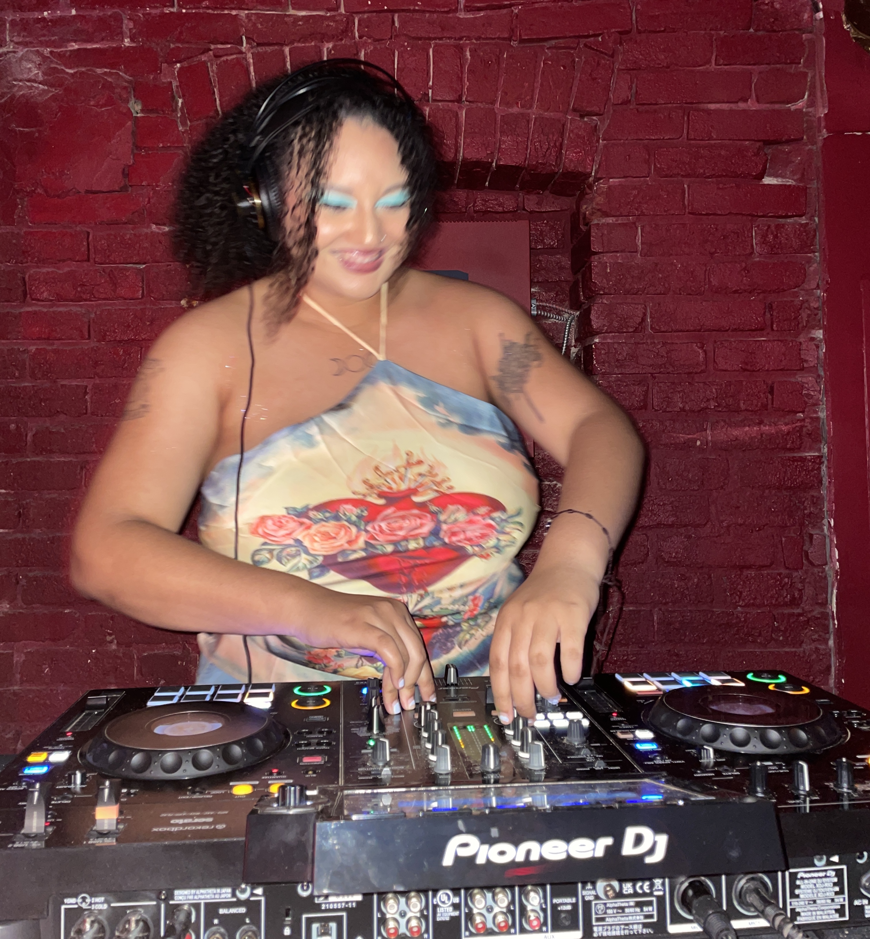 A photo of DJ SAINTJOHN at a live event behind the booth at a club