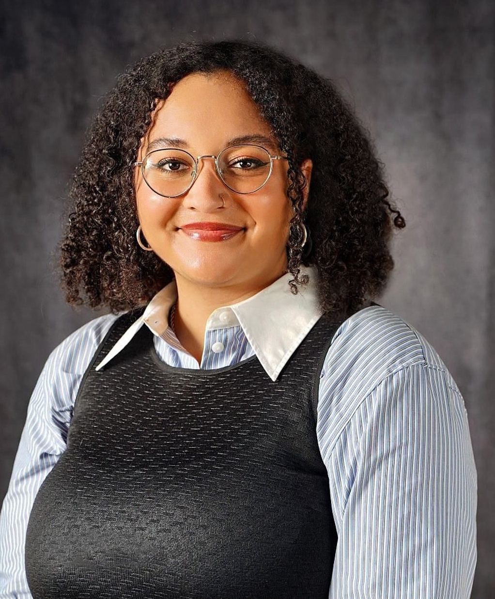 A headshot photo of Logan